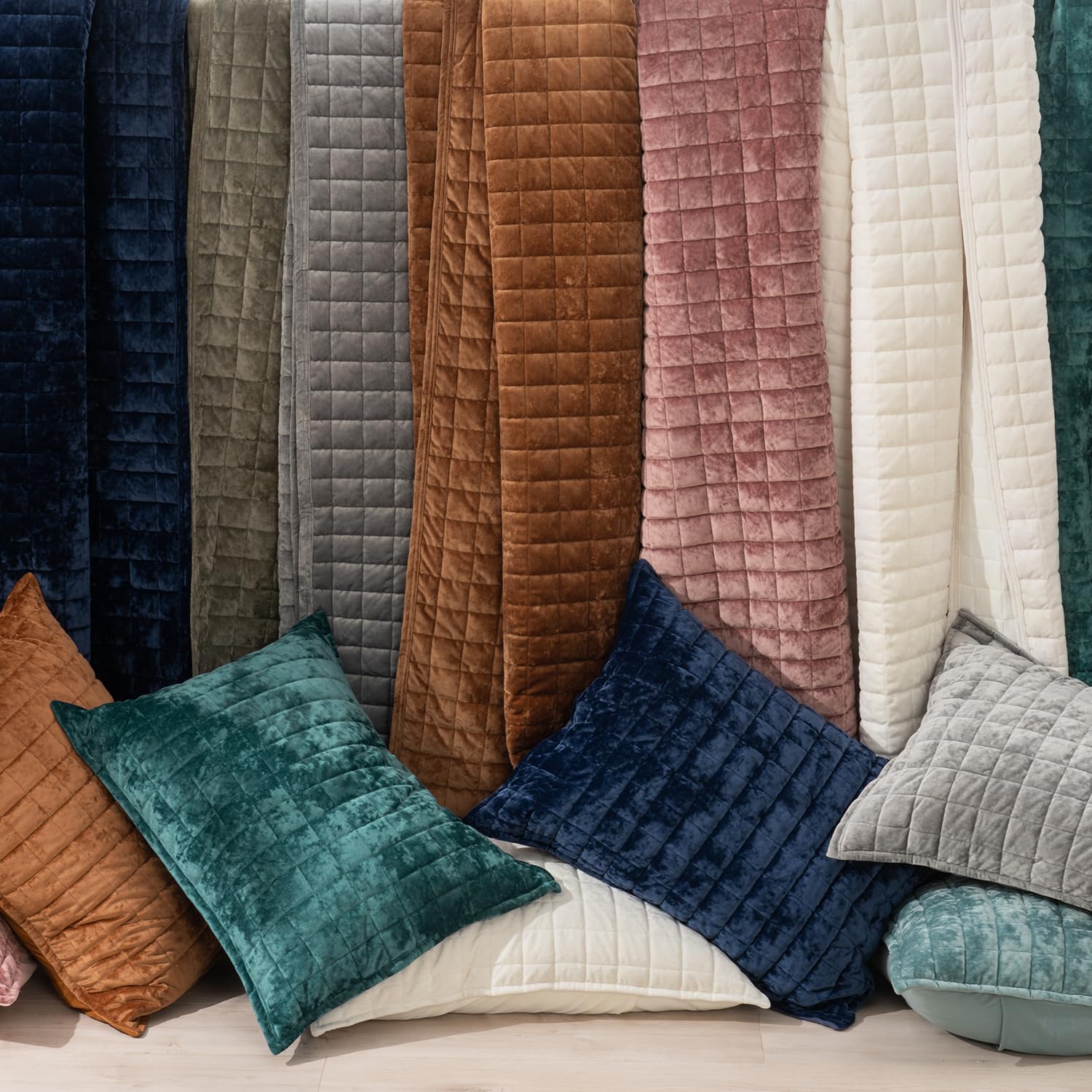 RECYCO quilt paired with decorative pillows showing styling versatility benefit