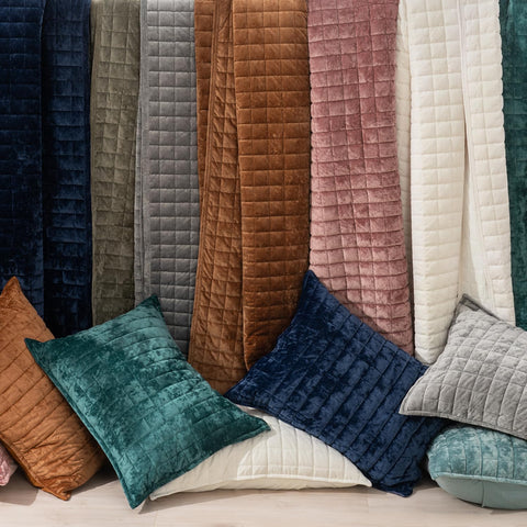 RECYCO quilt paired with decorative pillows showing styling versatility benefit