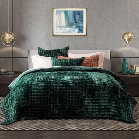 RECYCO velvet quilt front spread on king bed, showcases luxe emerald finish and polished look