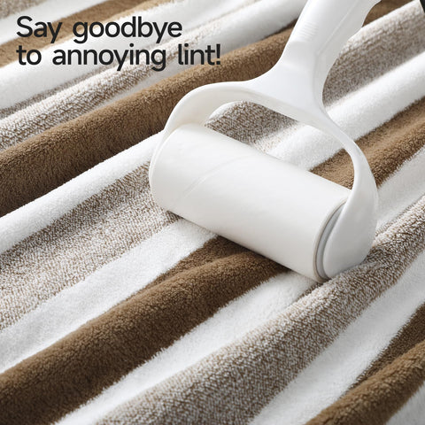 REDKISS bath towel next to person showing oversized coverage and fit
