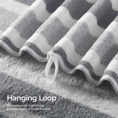 REDKISS gray towels on a bathroom rack conveying neat styling and fast drying