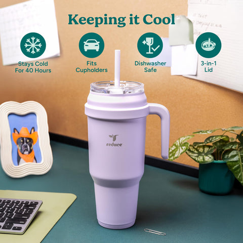 REDUCE tumbler with handle being held for comfortable portable carrying