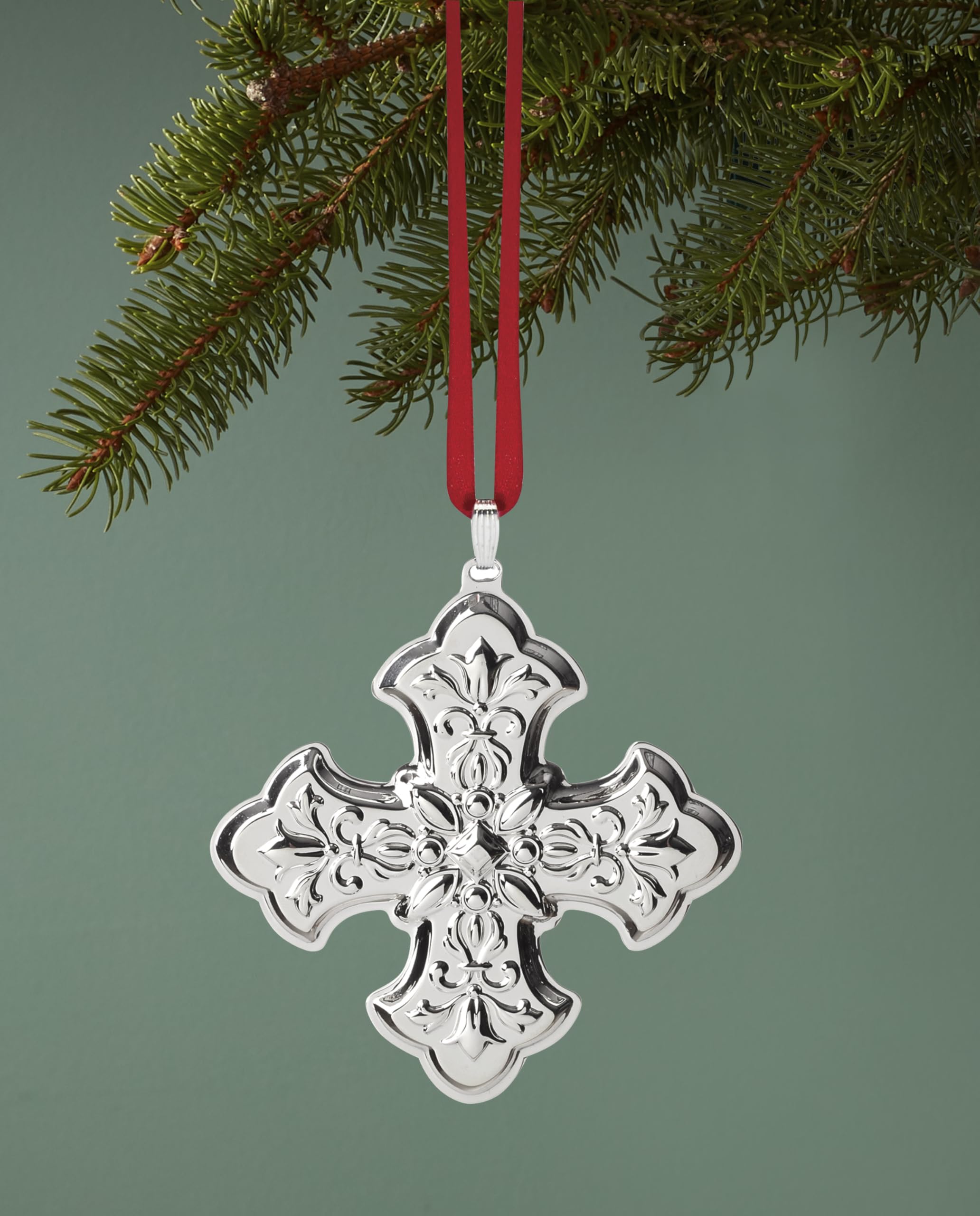 Reed & Barton cross ornament on mantel in holiday setting adding elegant charm benefit