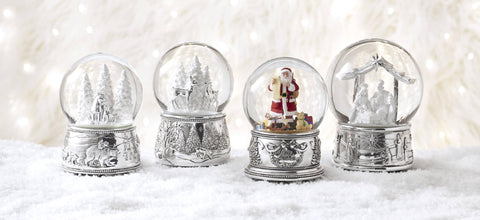 Reed & Barton musical snow globe displayed on mantel adding seasonal warmth and tradition