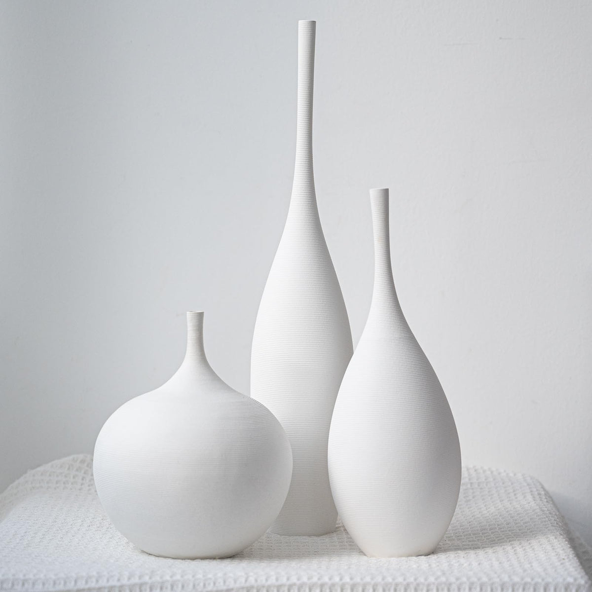 Relexome front view of three vases showing balanced trio for tabletop styling