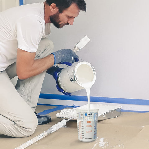 Reli. poured paint from cup showing smooth pour control and visible color mixing