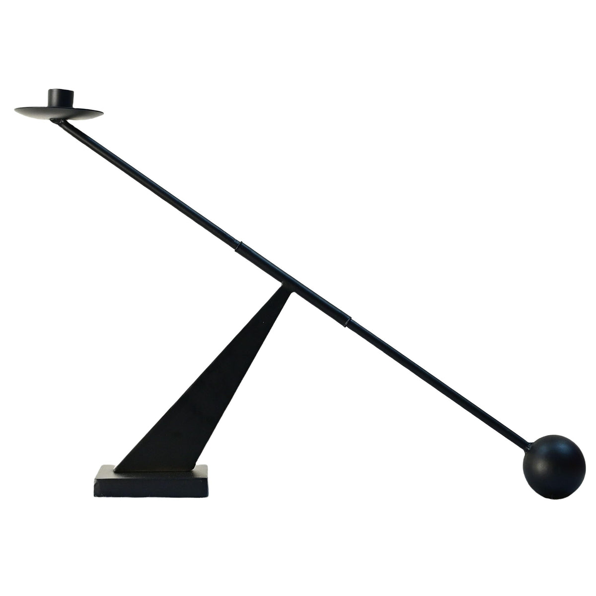 Remenna black metal candlestick front view showing sleek modern silhouette and visual impact