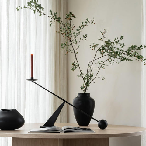 Remenna candlestick styled on a mantel showing how it enhances room decor