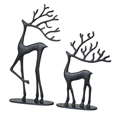 Remenna deer next to stacked books showing size and scale for tabletop placement