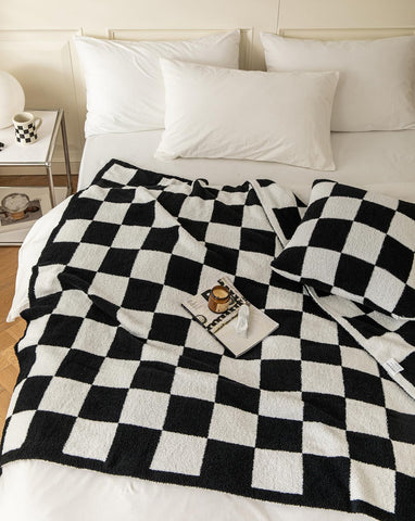 REPRECONF folded at bed footboard adding warmth and decor