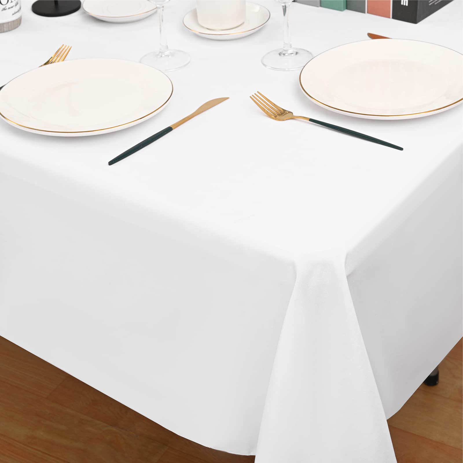 REWOMC ten folded tablecloths stacked illustrating bulk supply convenience