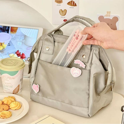 RICHTRUE lunch bag beside a water bottle showing scale and roomy capacity