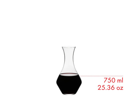 Riedel decanter pouring wine into glass demonstrating controlled pour and sediment separation