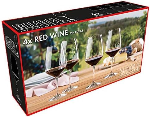 Riedel glass in table setting with wine poured illustrating refined tasting and entertaining benefit