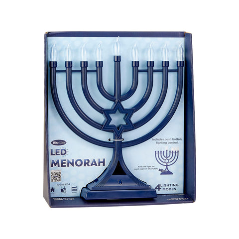 Rite Lite menorah in use on mantel with family celebrating Chanukah showing convenience and festive atmosphere