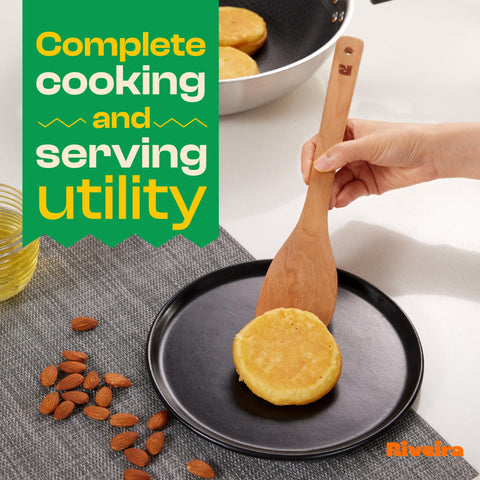 Riveira spoon stirring sauce in pan demonstrating gentle use on nonstick cookware