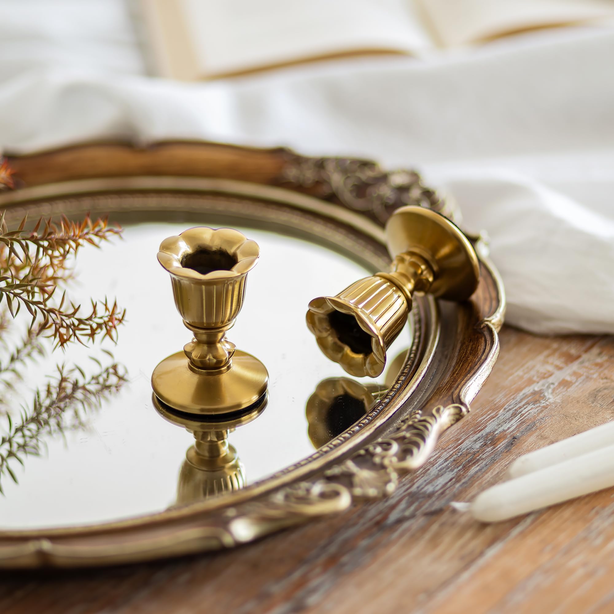 Romadedi close-up of floral base detail highlighting textured brushed brass elegance