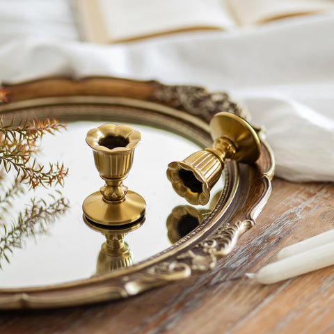 Romadedi close-up of floral base detail highlighting textured brushed brass elegance