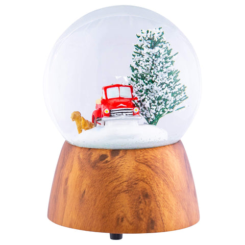 Roman snow globe on mantel in holiday scene, creates cozy atmosphere