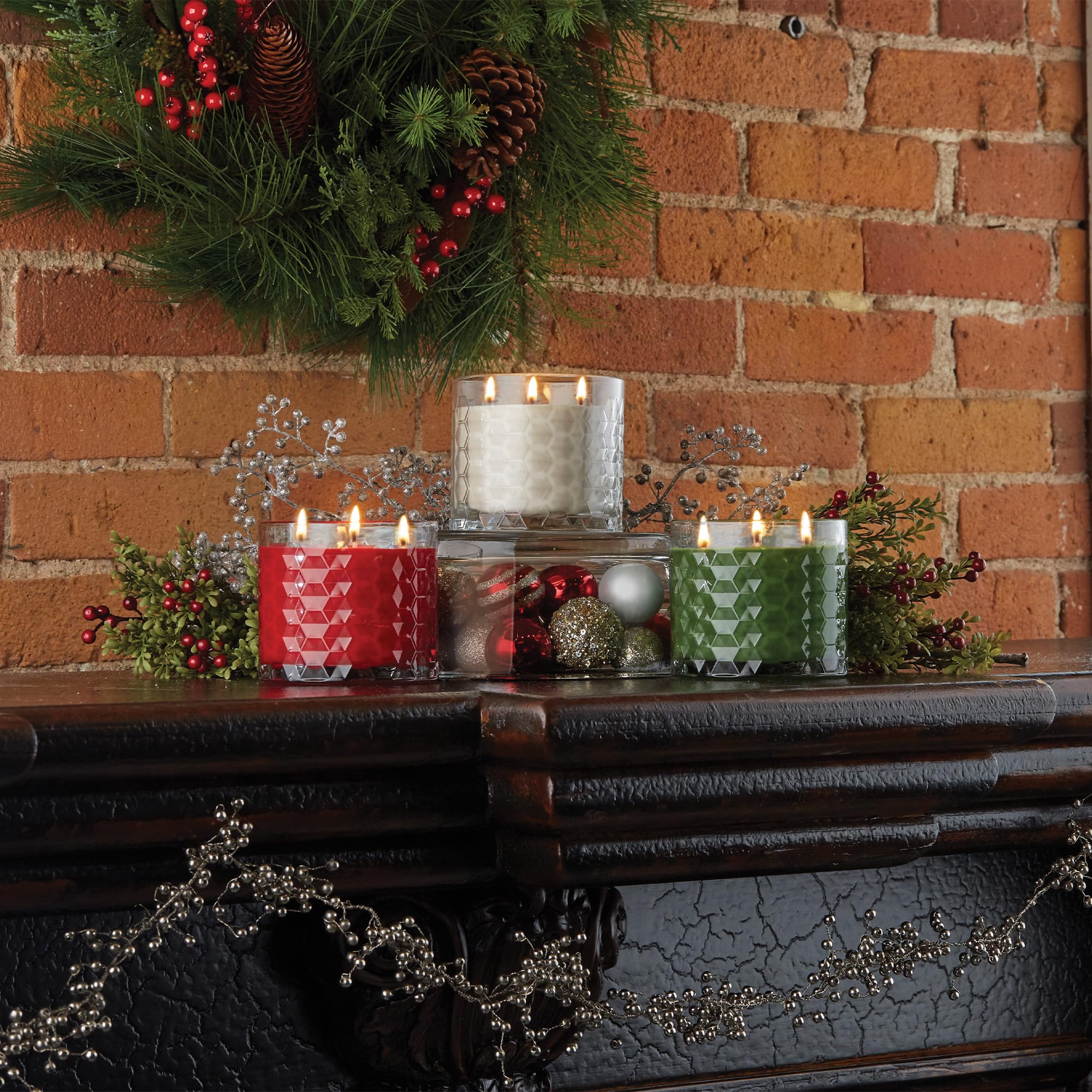 Root candle held by hand for size comparison showing 12-ounce scale and travel-friendly size