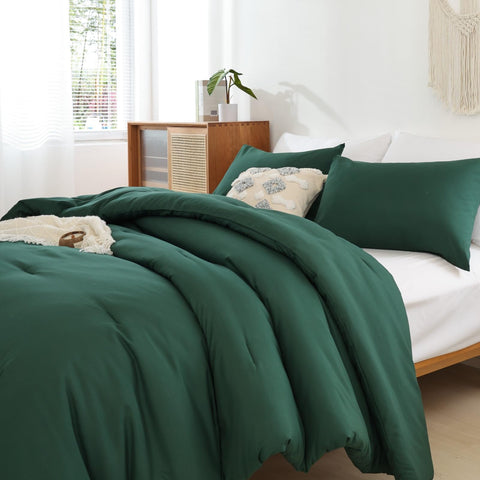 ROSGONIA styled on a king bed demonstrating emerald color as focal point