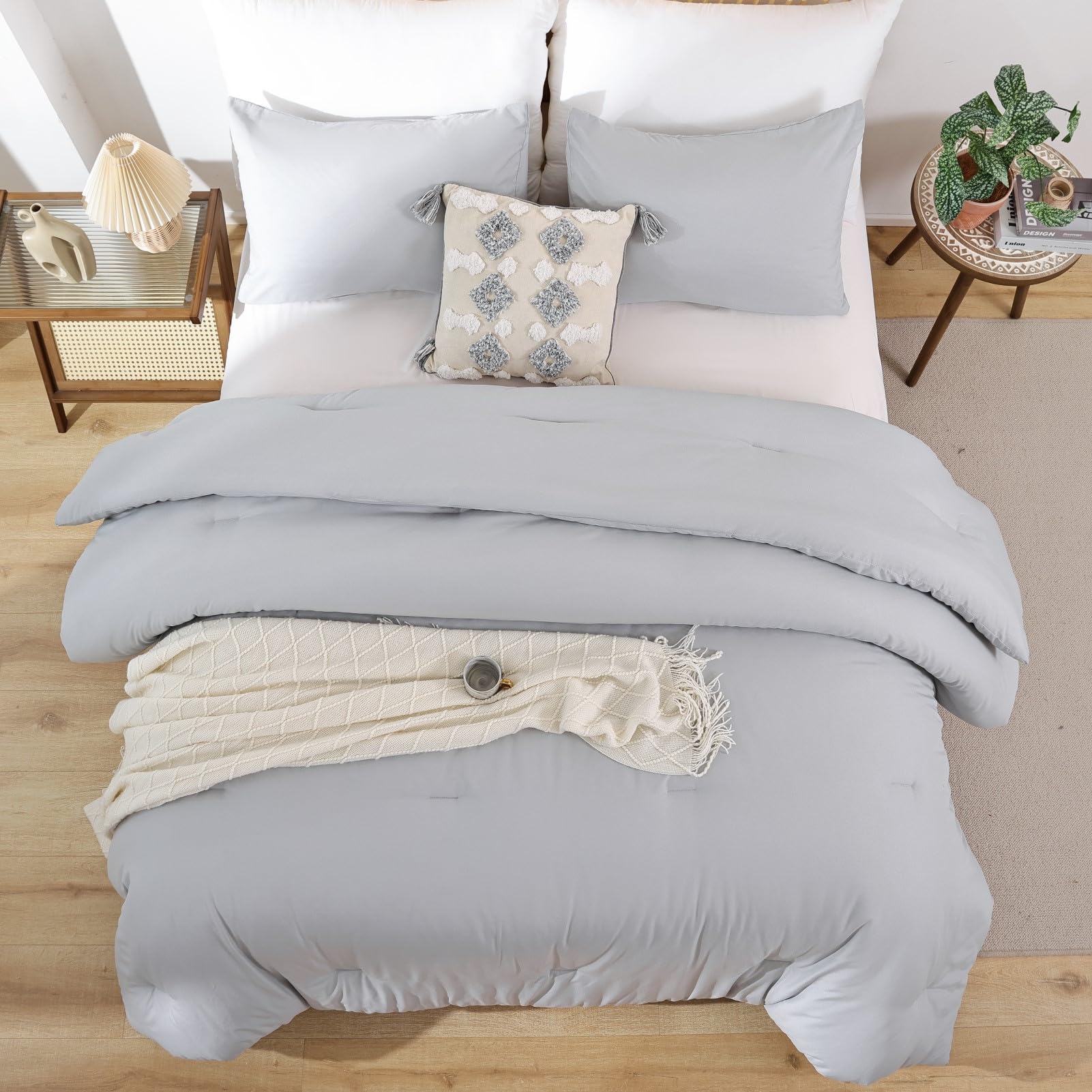 ROSGONIA styled bedroom with comforter layered for versatile decor inspiration