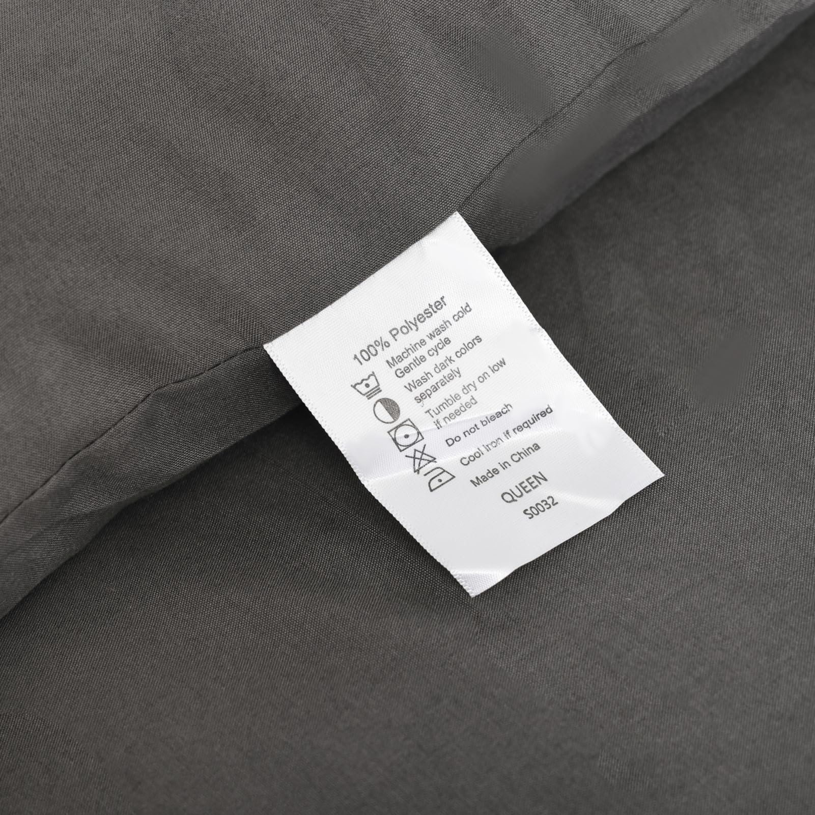 ROSGONIA styled bedroom scene showing charcoal comforter matching decor