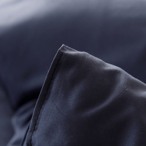 ROSGONIA navy comforter under soft lighting showing cozy, calming bedroom mood