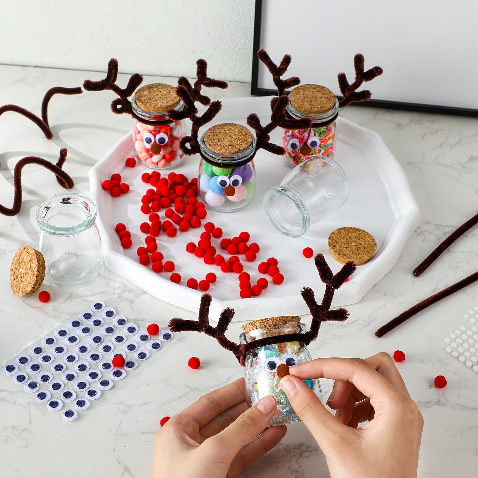 Roshtia party table with finished reindeer jars used as festive favors