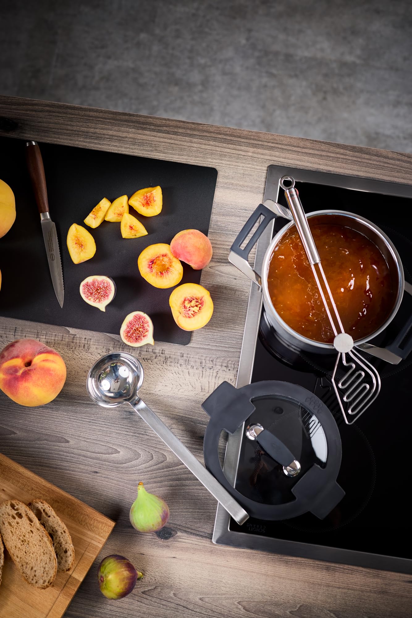 Rösle ladle scooping soup from pot demonstrating precise serving