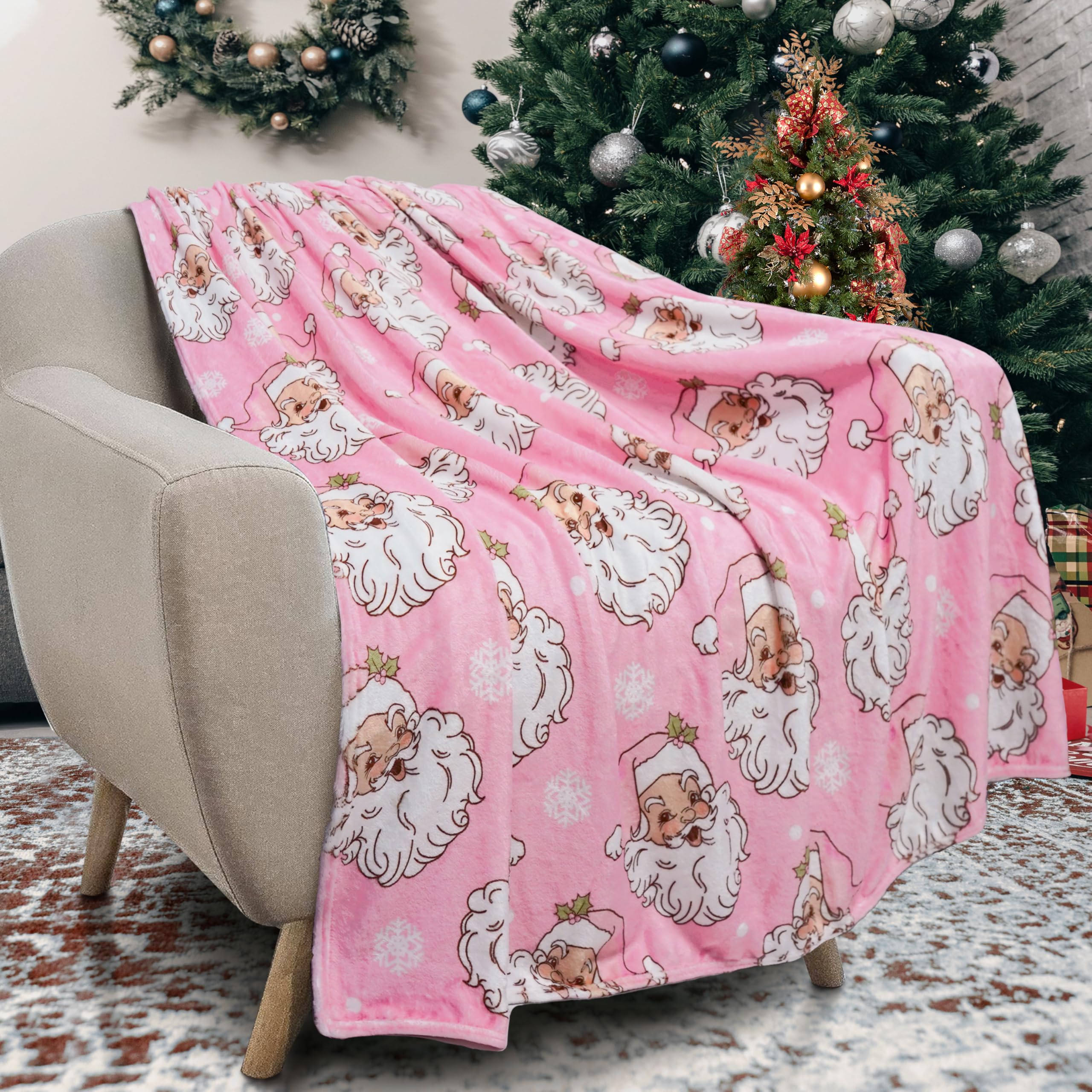 Roszwtit front view of Christmas throw showing festive Santa print and cozy look