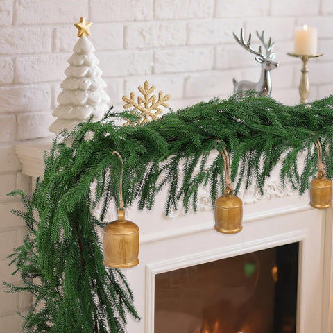 Rowfad garland wrapped around stair rail providing secure, shaped decoration benefit