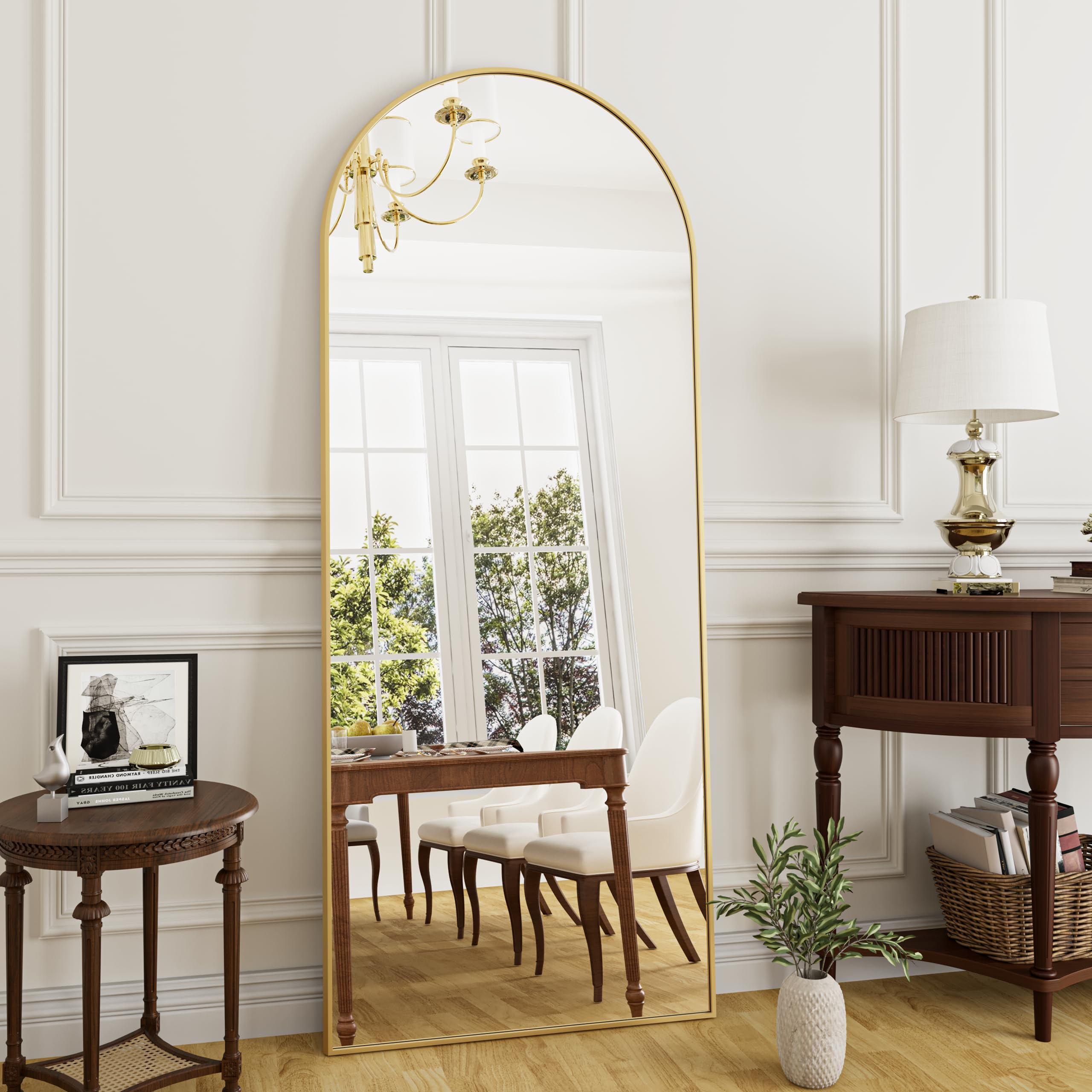 Rowjut arched mirror front view with gold frame enhances room elegance