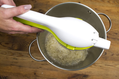 RSVP SPUD mashing potatoes over a pot demonstrating smooth lump-free results