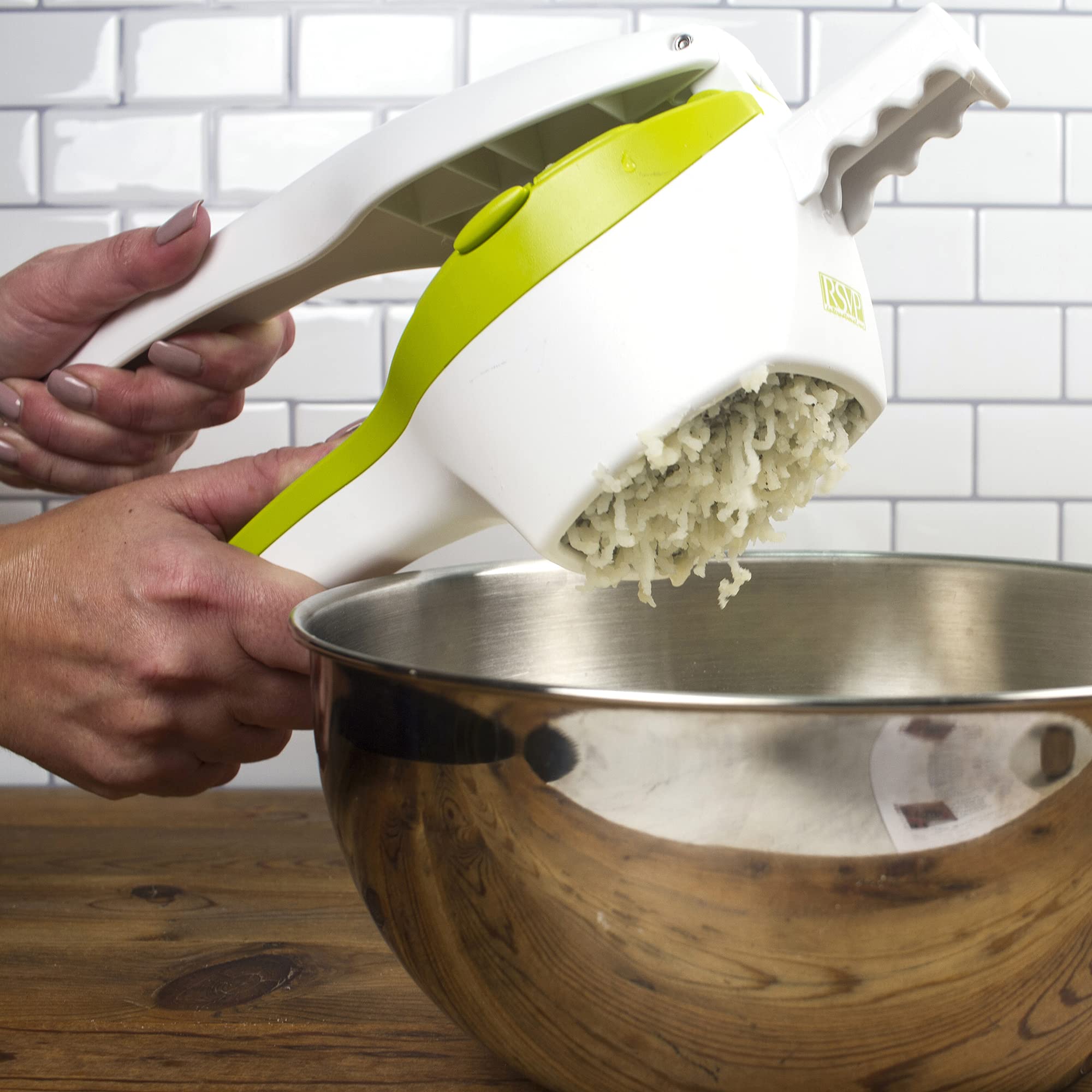 RSVP SPUD pot-rest extension seated on a saucepan for stable hands-free pressing