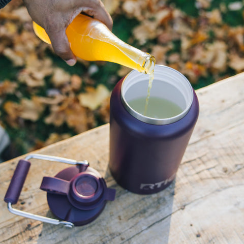 RTIC Outback Jug pouring water into cup demonstrating controlled pour
