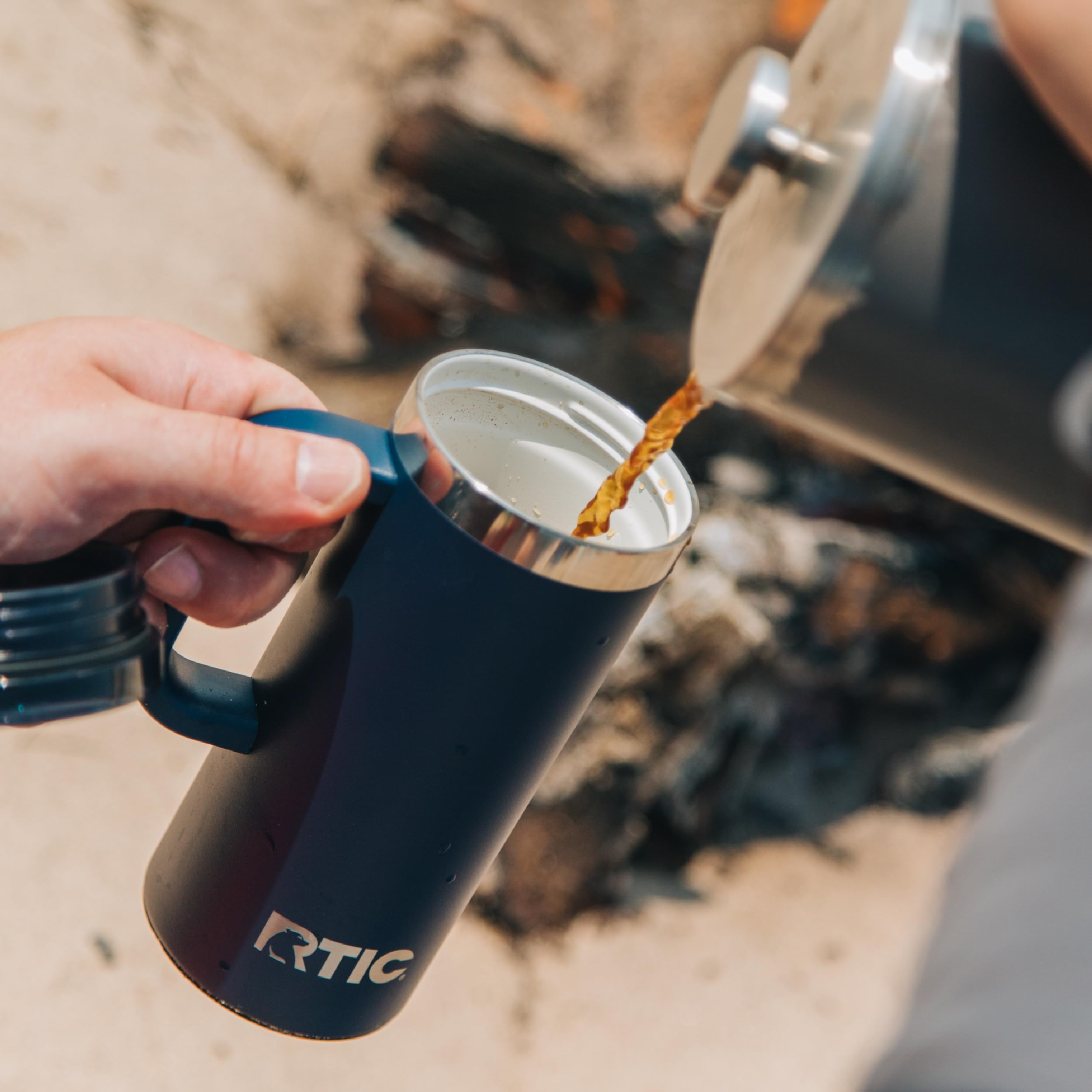 RTIC mug held in hand for size and 16oz capacity visual scale benefit