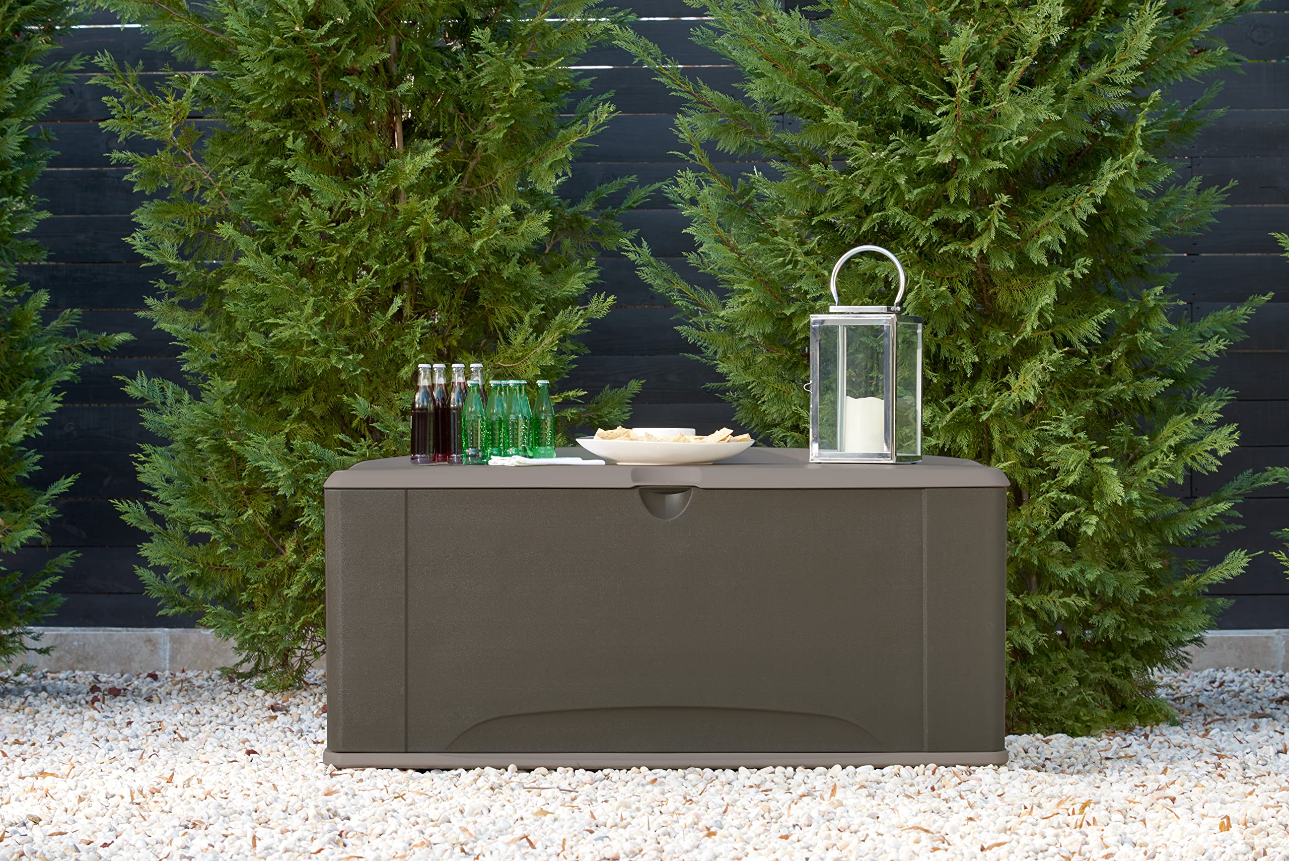 Rubbermaid family sitting on closed lid showing extra seating convenience