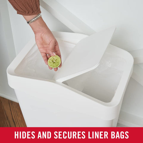 Rubbermaid open interior with trash bag demonstrating easy liner replacement