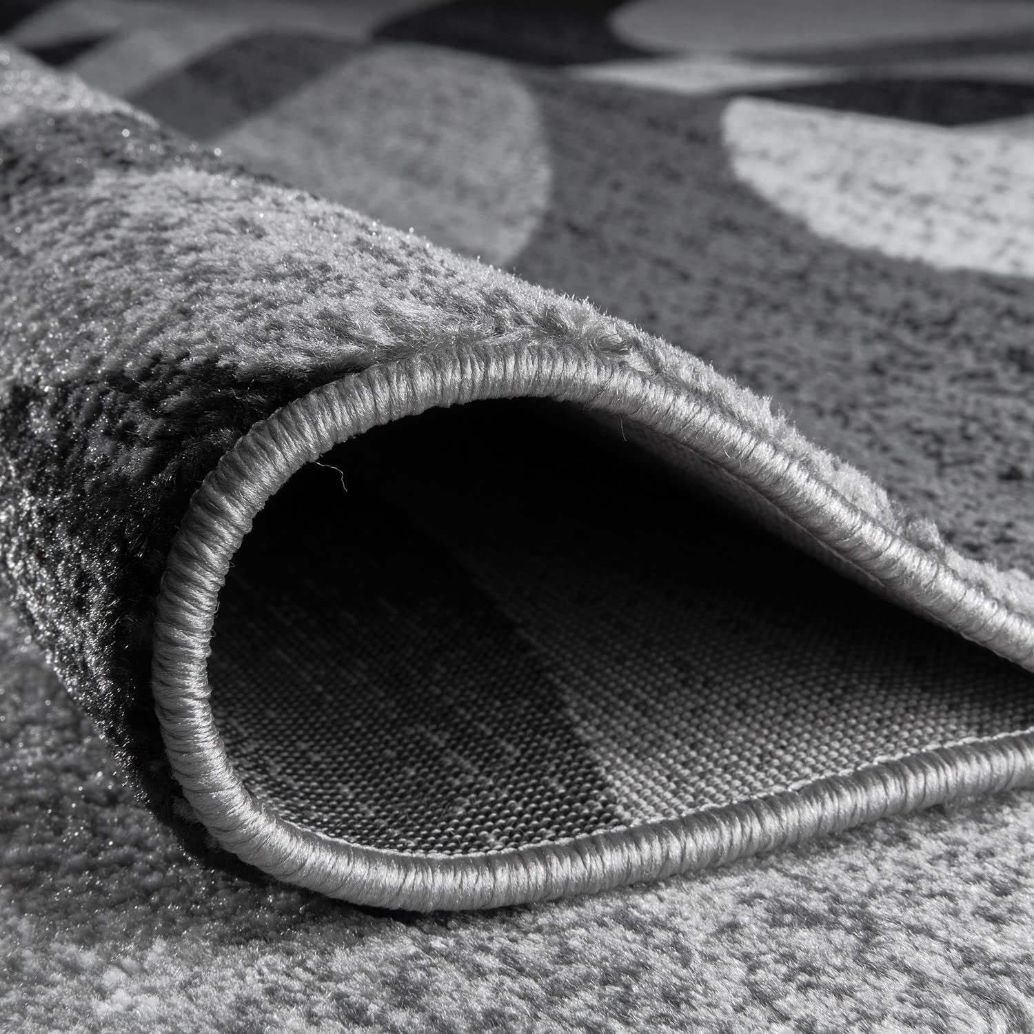 Rugshop rug placed under sofa to show size fit and door clearance benefit