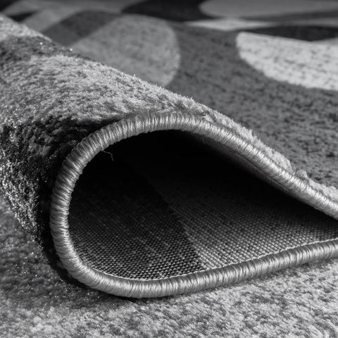 Rugshop rug placed under sofa to show size fit and door clearance benefit