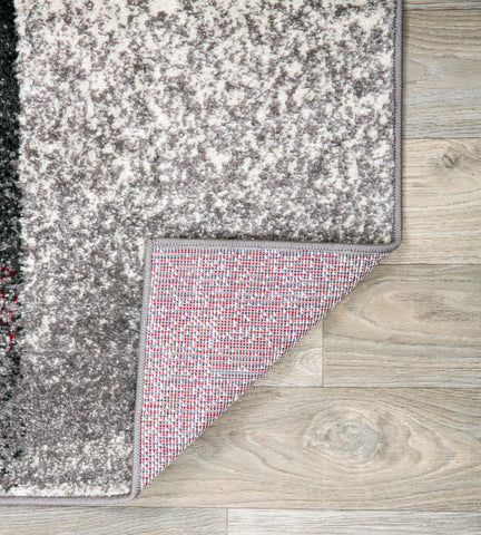Rugshop rug styled in living room demonstrating how it ties furniture together