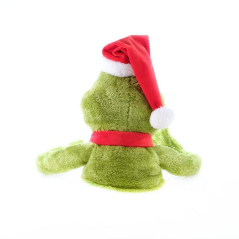Ruz Grinch perched on decorated Christmas tree, brings festive humor and charm