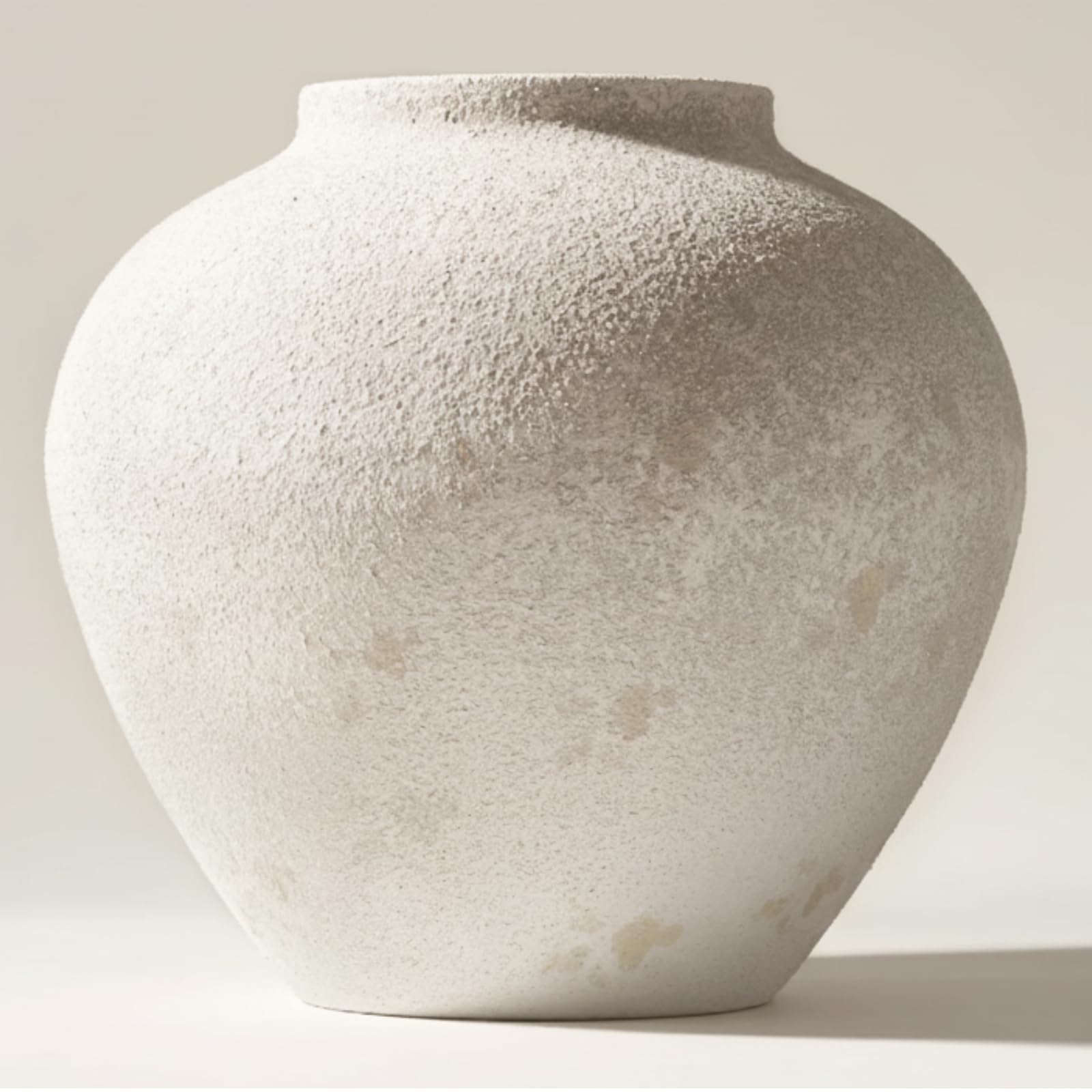 RyddeligHome Arina front view showing round white rustic vase enhancing table centerpiece