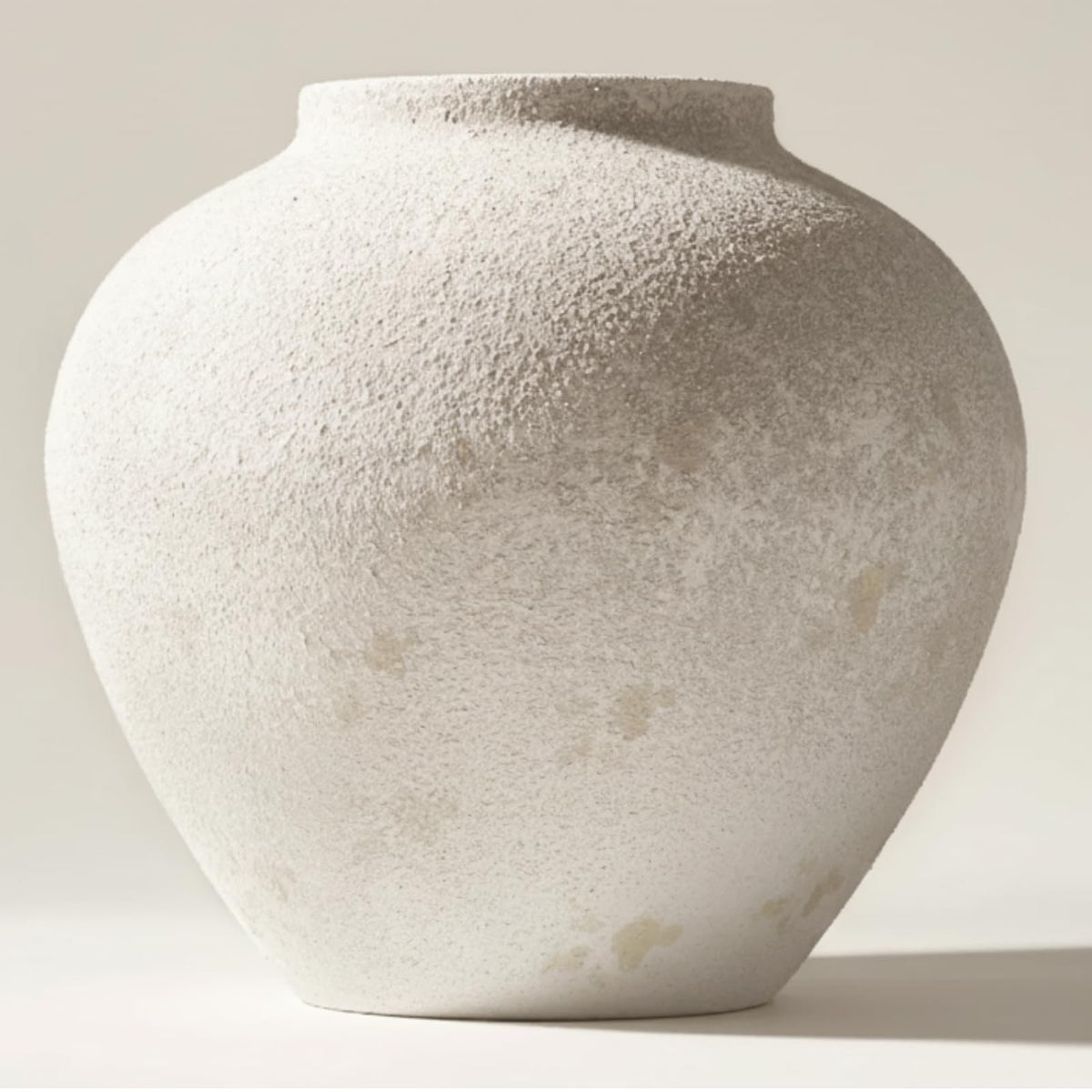 RyddeligHome Arina front view showing round white rustic vase enhancing table centerpiece