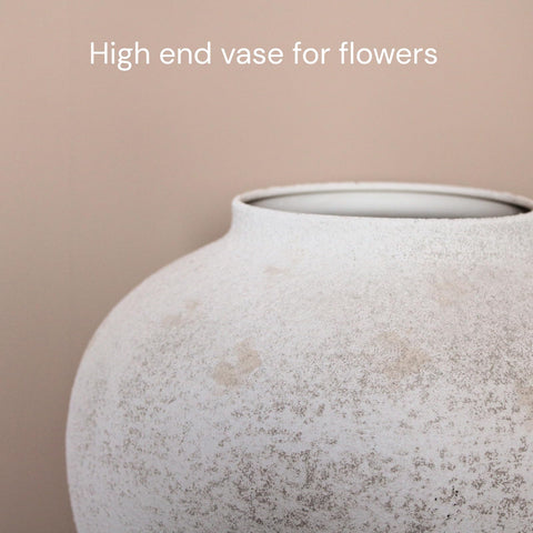 RyddeligHome vase with faux flowers illustrating long-stem support and natural styling