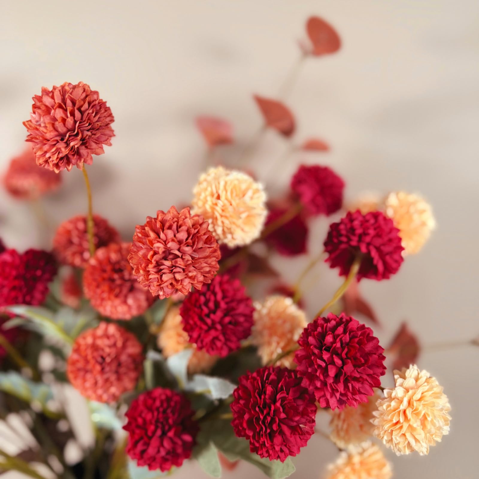RyddeligHome stems arranged in a tall vase demonstrating elegant vertical centerpiece styling