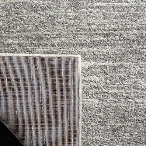 SAFAVIEH Adirondack size comparison showing 9x12 scale beside sofa for room fit