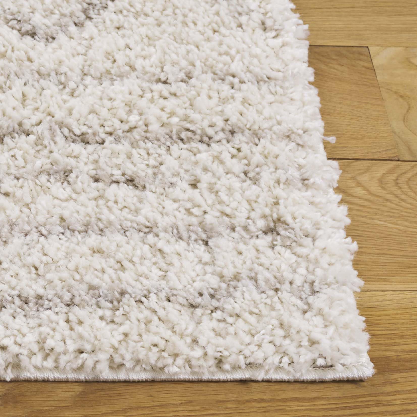 SAFAVIEH rug laid under sofa for scale, improving room cohesion and warmth