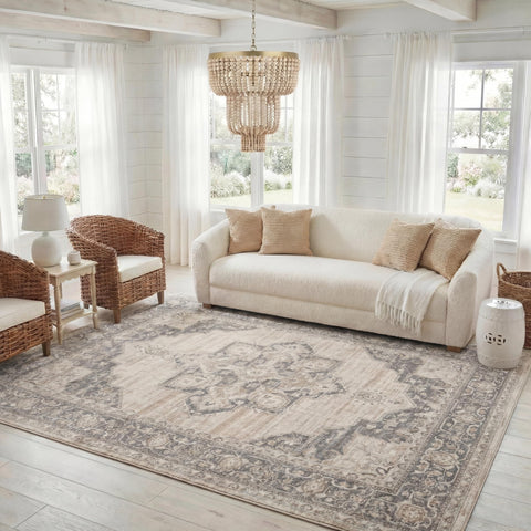 SAFAVIEH rug next to sofa showing 8x10 scale for proper furniture fit